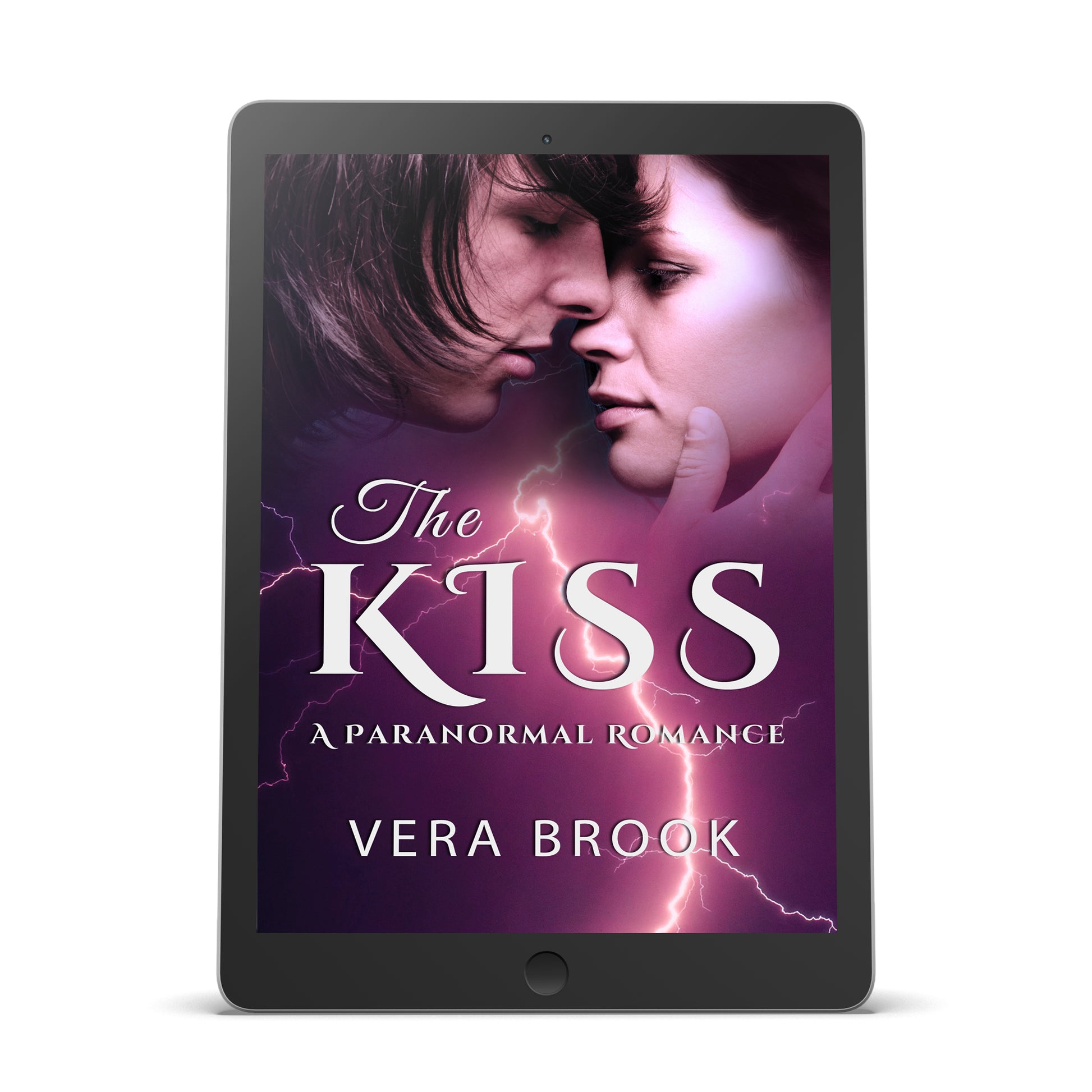 Ebook cover of THE KISS, a paranormal shifter romance by Vera Brook. The cover shows a man about to kiss a woman against the background of purple sky torn by lightning. The title is in a bold, romantic font in white.